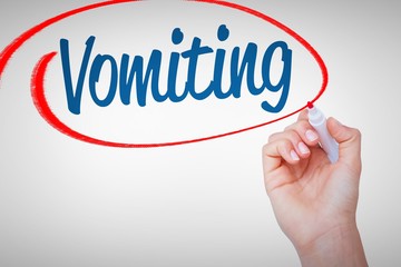 Vomiting against hand of woman holding red markers 