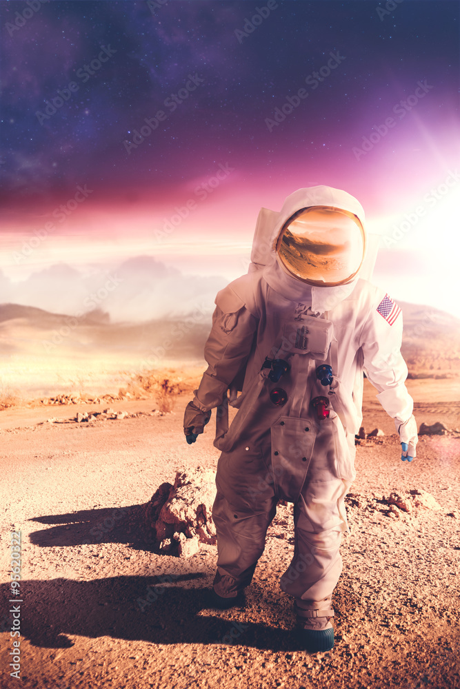 Wall mural astronaut walking on an unexplored planet