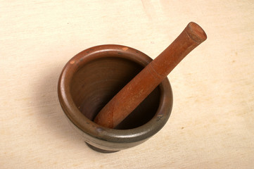 mortar and pestle made from clay 