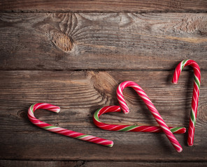 candy canes on wooden board