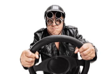 Focused senior driver holding a steering wheel