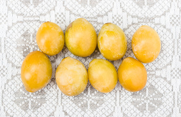Yellow plums on a linen background