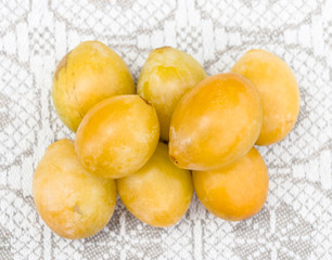 Yellow plums on a linen background