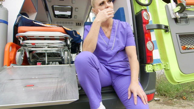 Emergency medical service stressed paramedic blaming himself for the loss a patient at the site of an illness or injury, jib crane shot