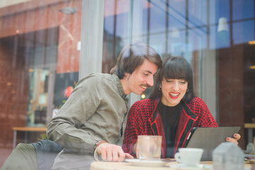 Couple of young beautiful caucasian woman and man with moustache