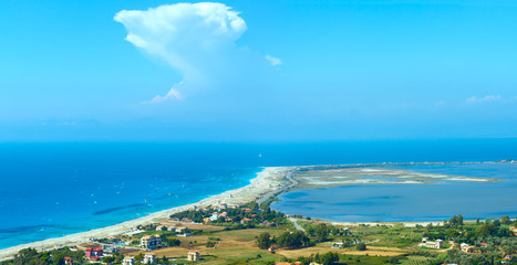 Sea coast panorama and kiteboarders.