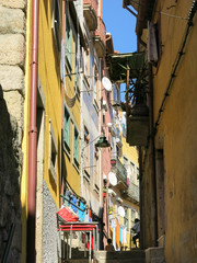 Fototapeta na wymiar One of many small medieval streets and alleyways in Ribeira district in Porto, Portugal