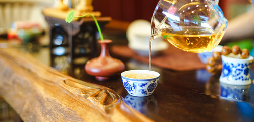 A cup of whole leaf lapsang souchong tea, a rich smoky flavored tea