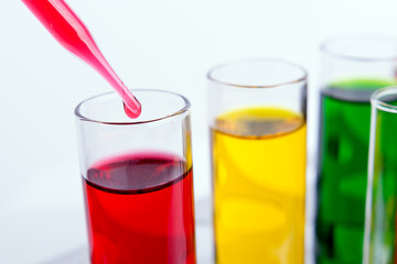 Liquid dripping from pipette into test tube