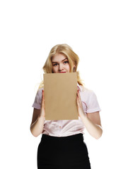 A girl holding a sheet of paper