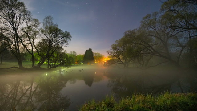 Foggy lake under moonlight