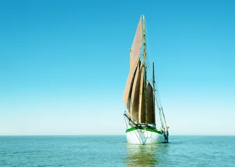 Fototapete Segeln Lonely sailing ship