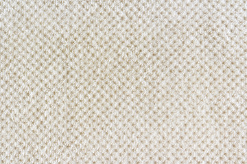 Beige carpet background, fabric close-up. Rug texture.