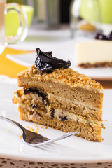 Piece of cake with cream, prunes 