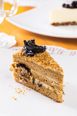 Piece of cake with cream, prunes 