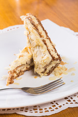 Napoleon cake on plate on table close-up