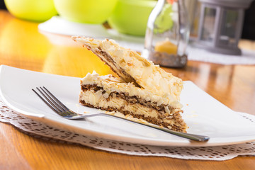 Napoleon cake on plate on table close-up