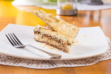 Napoleon cake on plate on table close-up