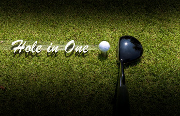 Golf driver driving ball with Hole-in-One caption