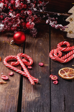 Christmas candies on rustic wooden board