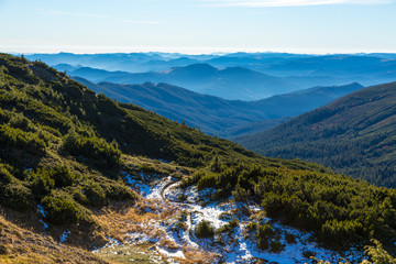 Naklejka na ściany i meble Winter Mountain View with Foggy Remote Ridges