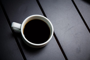 coffee cup on black table