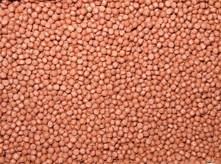 Granulated food for aquarium fish. The feed has a circular shape. Enhances color of fish.