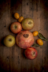 Organic fruits on a rustic wood background