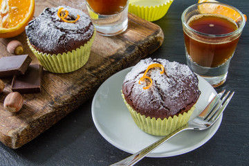 Chocolate and orange cupcake with coffee