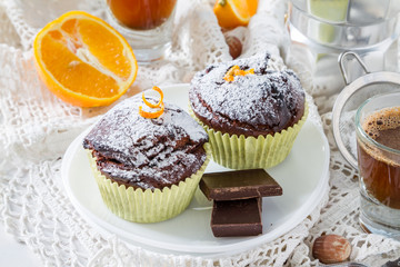 Chocolate and orange cupcake with coffee