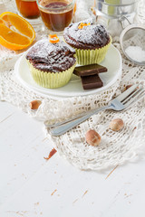 Chocolate and orange cupcake with coffee