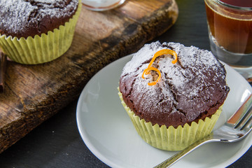 Chocolate and orange cupcake with coffee
