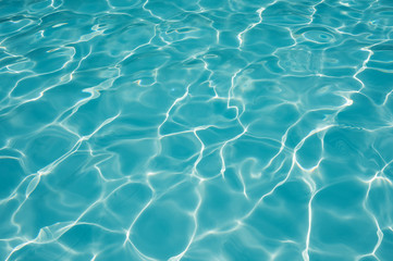 Naklejka na ściany i meble Detail rippled water surface in swimming pool