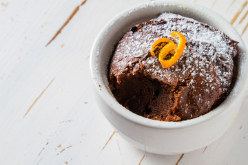 Chocolate and orange cupcake with coffee