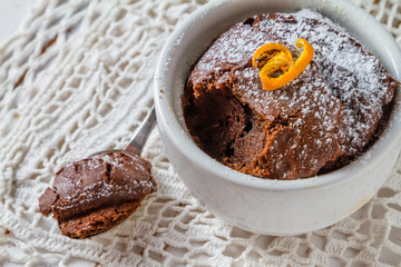 Chocolate and orange cupcake with coffee