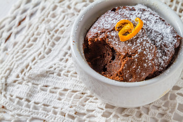 Chocolate and orange cupcake with coffee