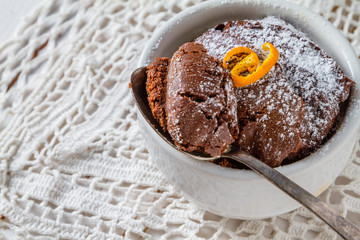 Chocolate and orange cupcake with coffee