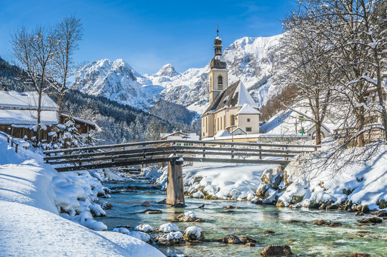 Idyllic mountain winter landscape with famous church and crystal clear river in Ramsau, Berchtesgadener Land, Bavaria, Germany - Powered by Adobe