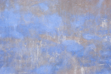 Gray cement wall with blue spots