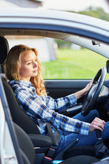 Naklejka premium young woman driving a car