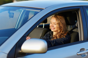 young woman driving a car