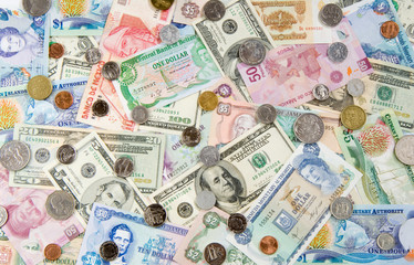 United States of America Passport with Money from Different Countries depicting a Global/World Economy and travel.  