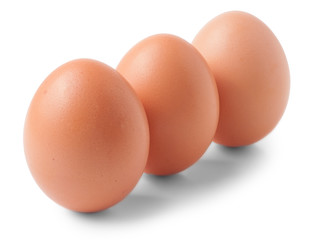 Three brown eggs isolated on white background