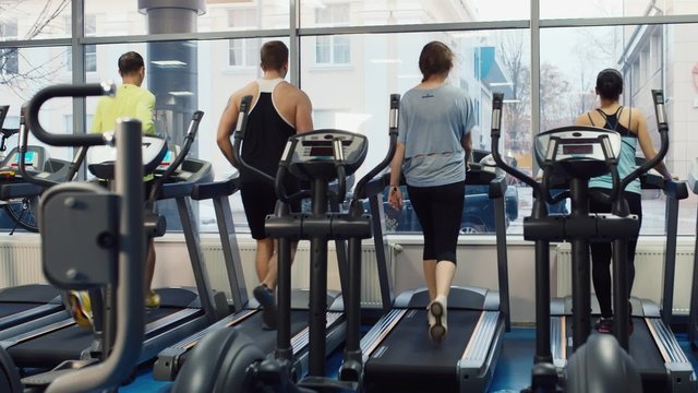 People are trained on a treadmill. In the picture, there is no recognizable faces