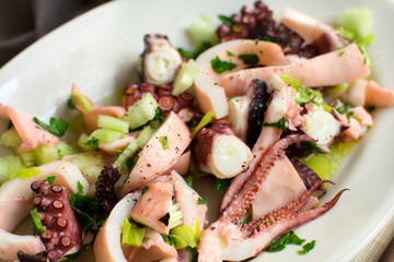Seafood salad made of different seafood and vegetables