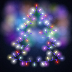Shiny fir tree with Christmas lights on blackboard background