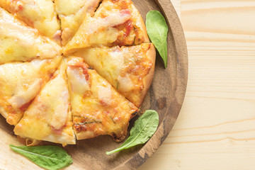 Rustic pizza on wooden background. Top view