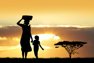 African woman and son at sunset