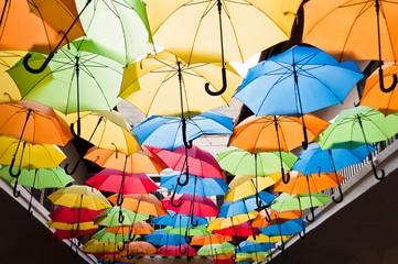 Street decoration with colorful open umbrellas hanging over the alley. Kosice, Slovakia