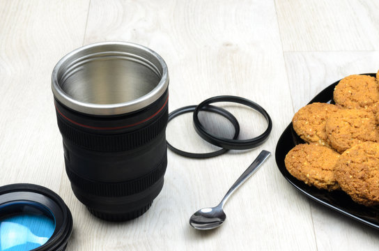 empty cup that looks like a camera lens - Powered by Adobe